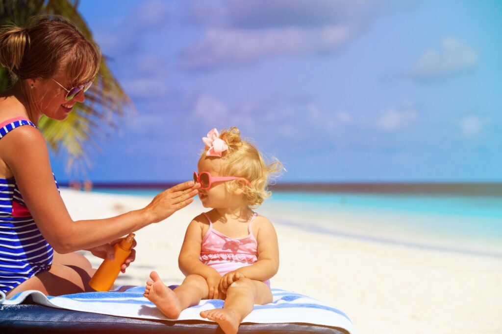 Women and Child Playing In The Beach