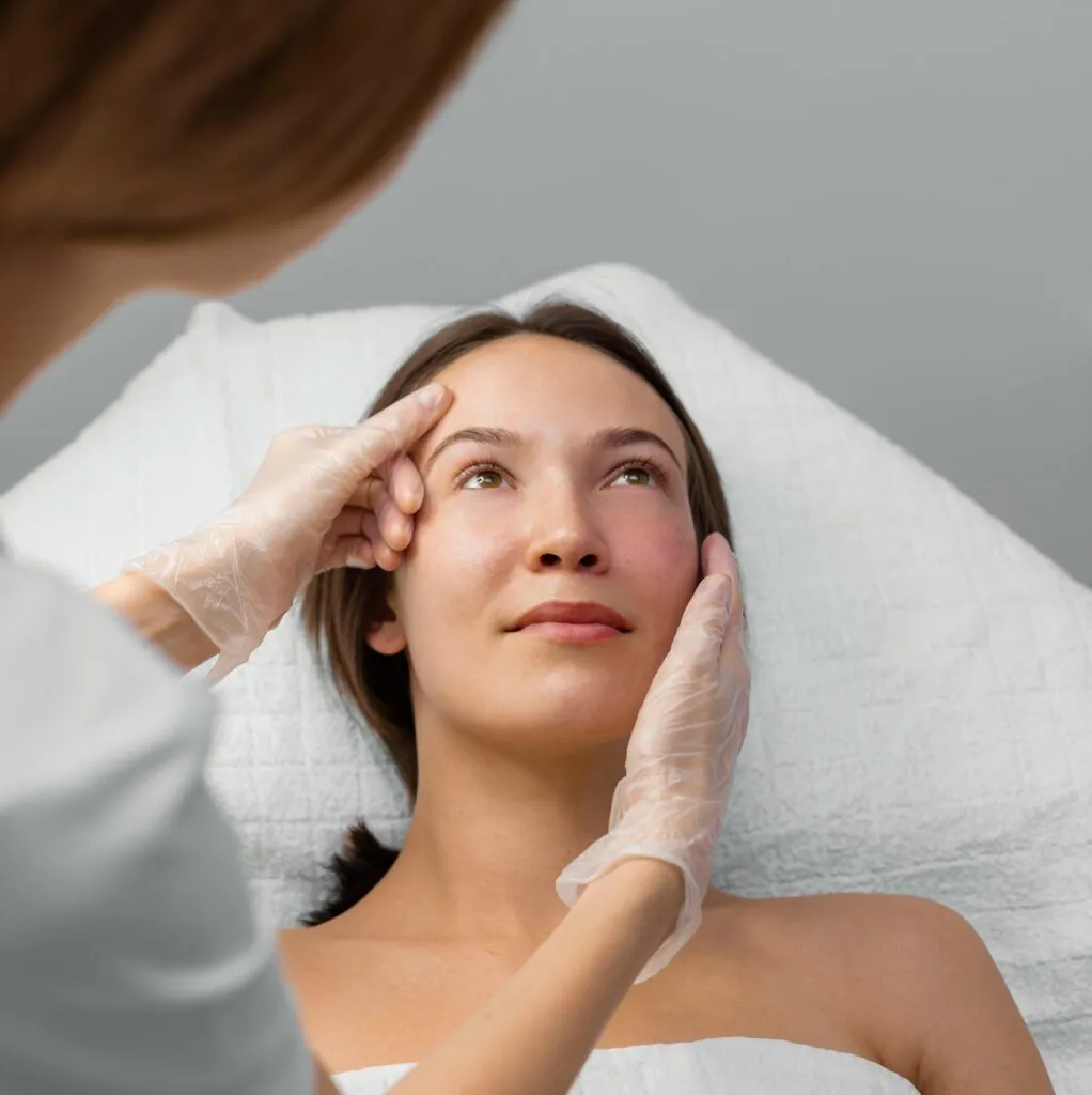 Patient receiving consultation at a plastic surgery center.