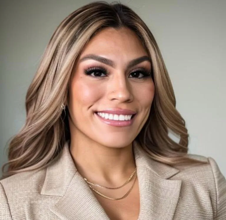 Smiling woman with flawless complexion and elegant hairstyle, representing confidence after cosmetic enhancement.