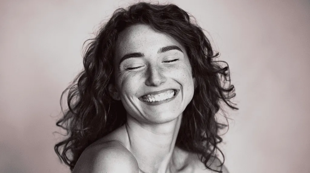woman with curly hair smiling