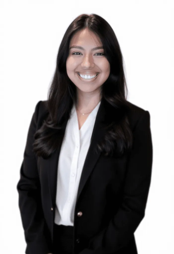 alt text: "Smiling professional woman with long dark hair in a business suit"