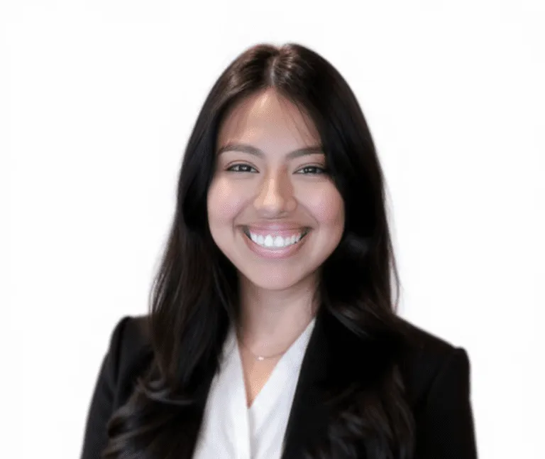 alt text: "Smiling professional woman with long dark hair in a business suit"