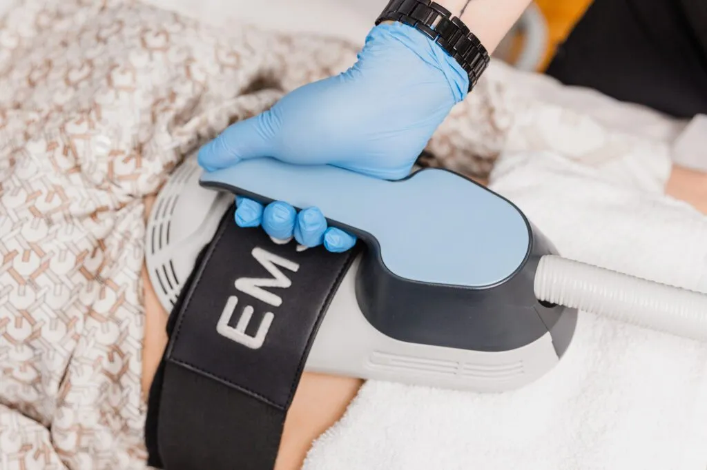 Non-invasive body contouring treatment with advanced equipment at a plastic surgery center.