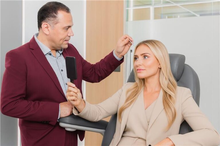 Plastic surgeon consulting with a patient in an office setting.